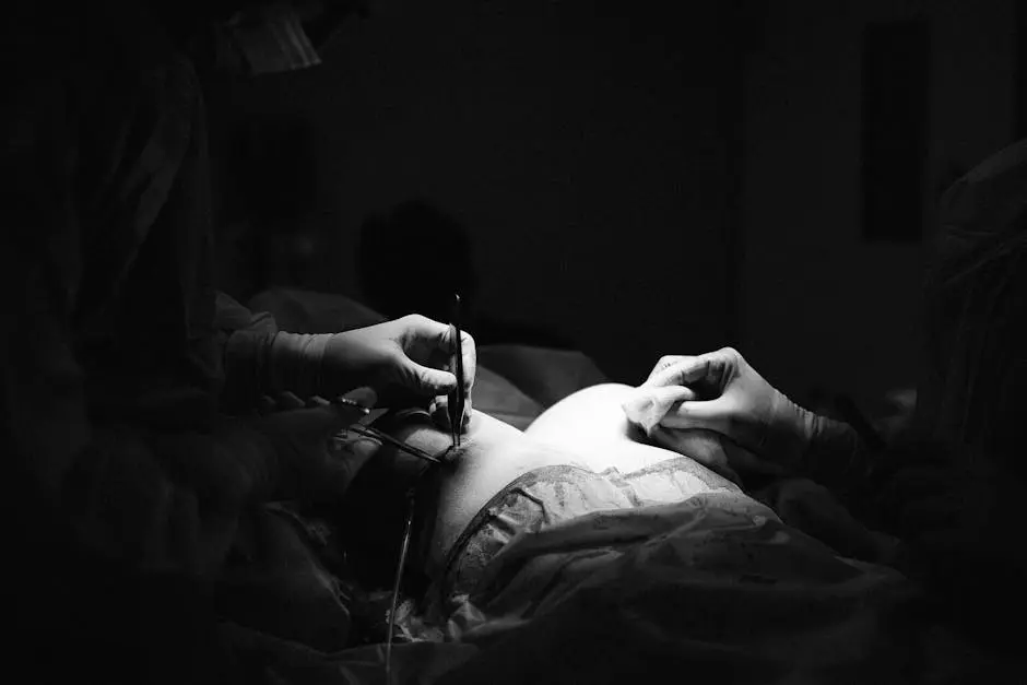 Black and white photograph of surgeons performing an operation, highlighting surgical precision.