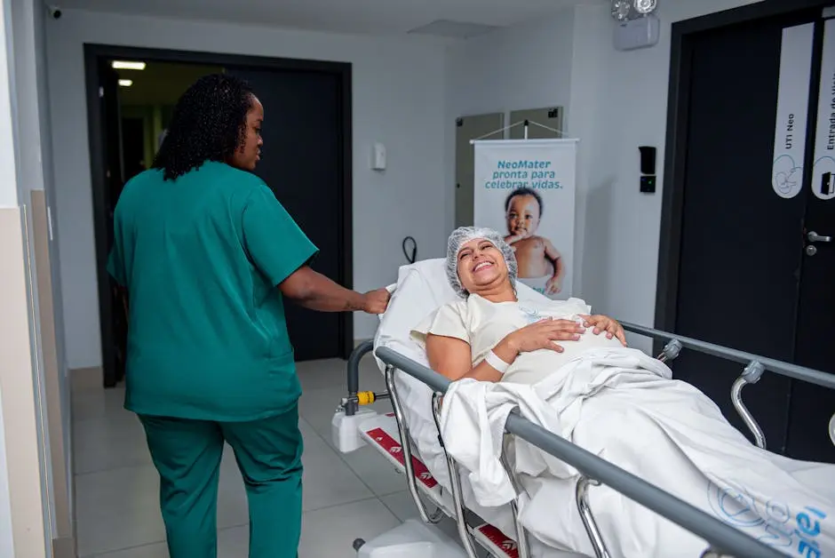 A caring nurse assists a patient in a hospital corridor with a joyful demeanor.
